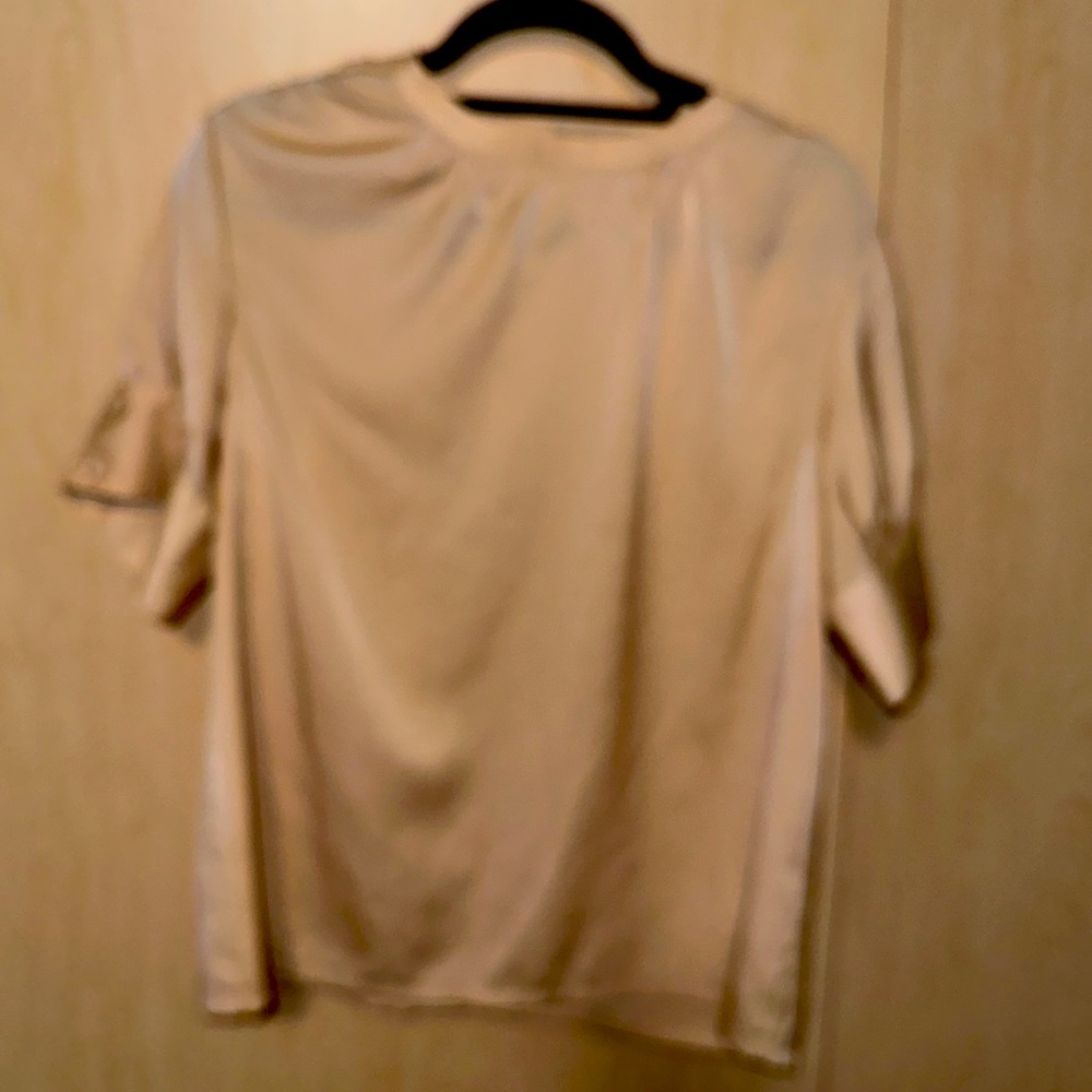 Woman’s beautiful soft golden yellow blouse